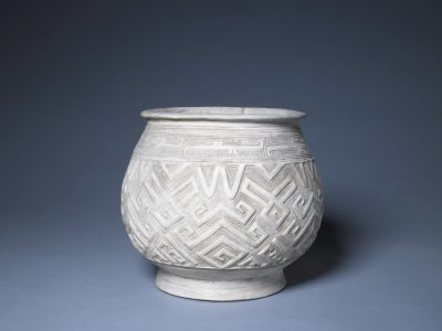 White pottery carved geometric lines vial